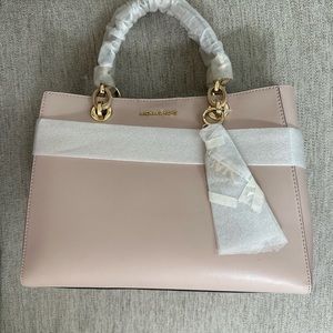Michael Kors hand bag pink with strap